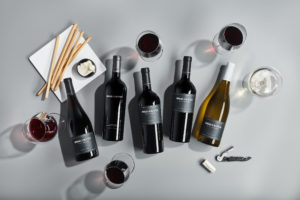 Bread & Butter Shop All Wines Header Image featuring Napa Valley and Cellar Collection Wines. From left to right: Napa Valley Pinot Noir, Atlas Peak Cabernet Sauvignon, Howell Mountain Cabernet Sauvignon, Napa Valley Cabernet Sauvignon, and Napa Valley Chardonnay.