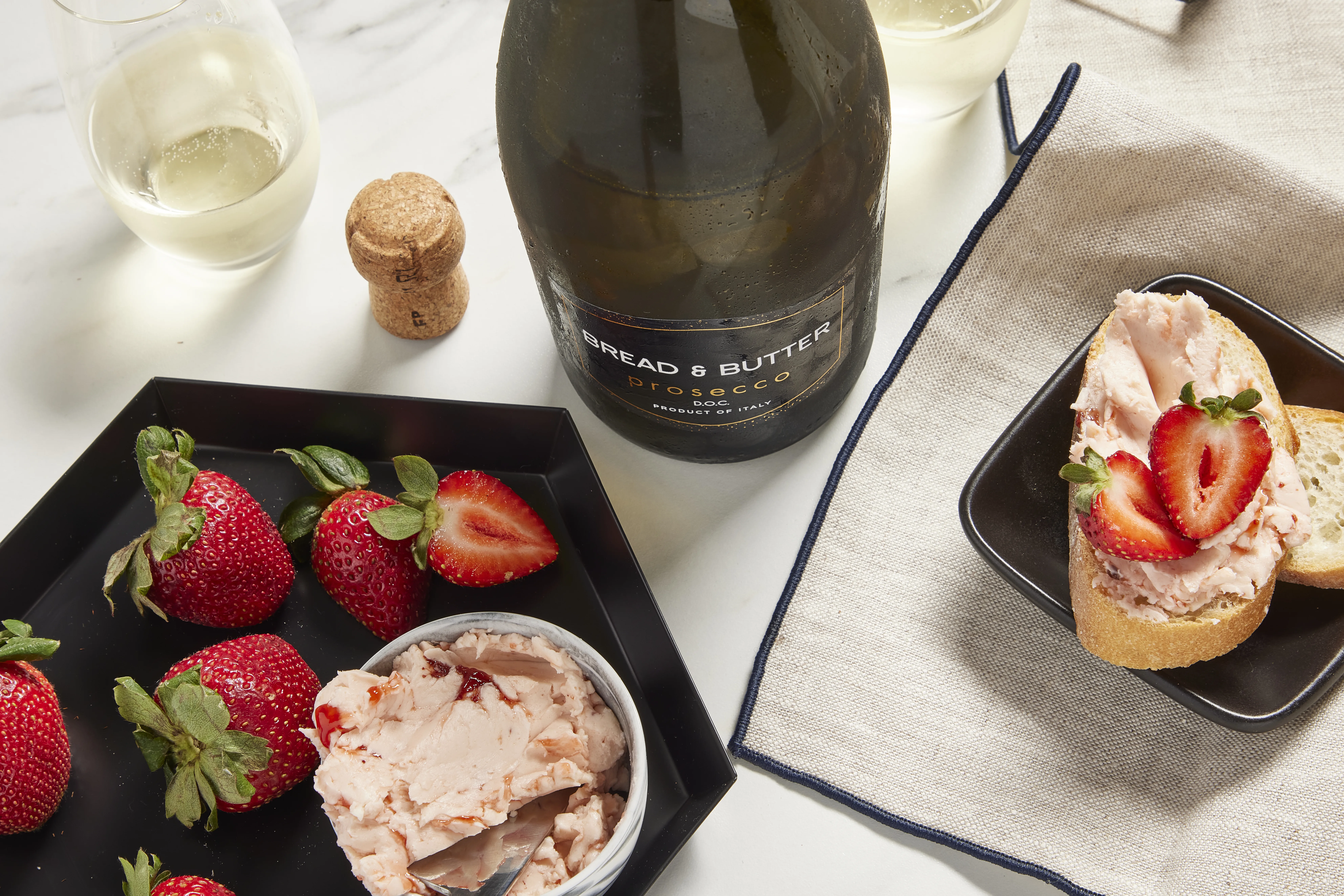 Strawberry butter paired with a bottle of prosecco